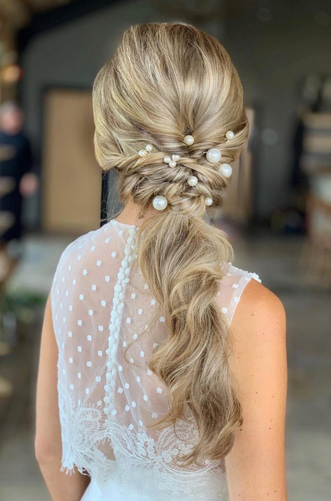 twisted messy ponytail bridal haistyles with large pearl pins